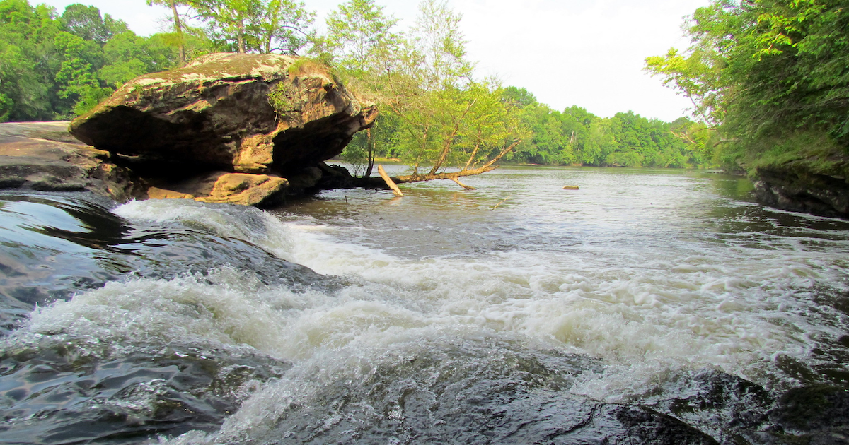 water flows over rocks at Lanier Falls in Raven Rock, North Carolina
