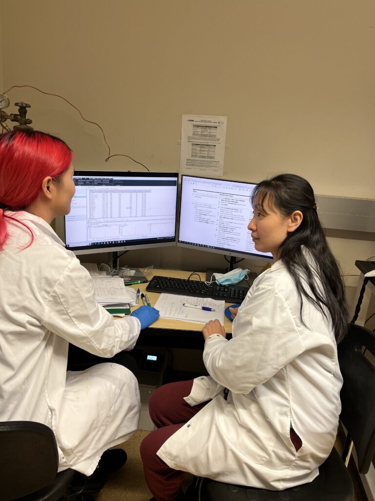 Dr. Yingying You (left) and Dr. Mei Sun (right) discuss and analyze data.