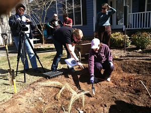 FOBC members and homeowners work on the first stage of the rain garden. 